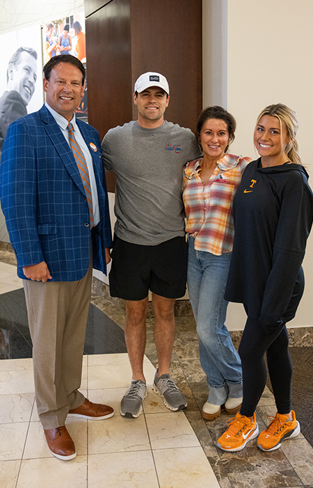 The four members of Shuler family standing together for a photo.