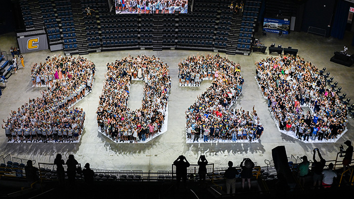 Aerial photo of a crowd of students grouped together to form the word 2028.