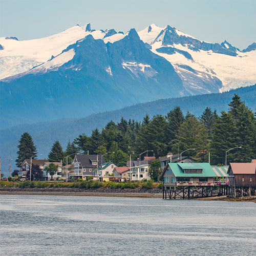 A row of houses on waterfront property in south-east Alaska.