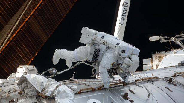 An astronaut spacewalking while working on the International Space Station.