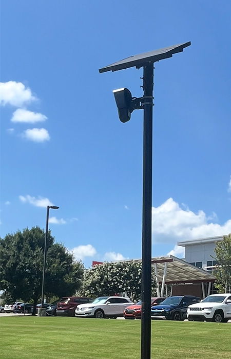 A metal pole and license plate reader.