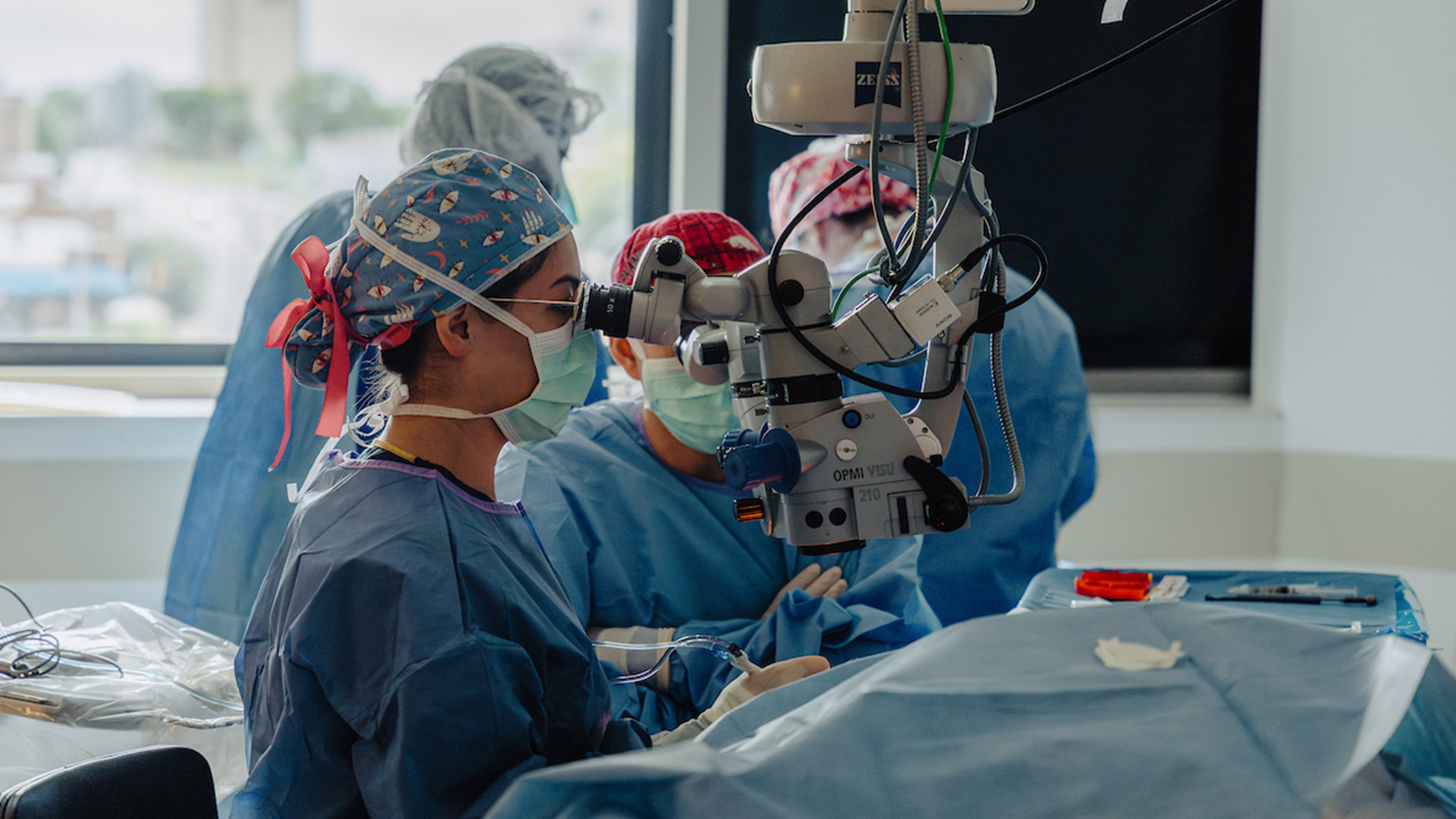 A medical team using equipment to perform cataract surgery.