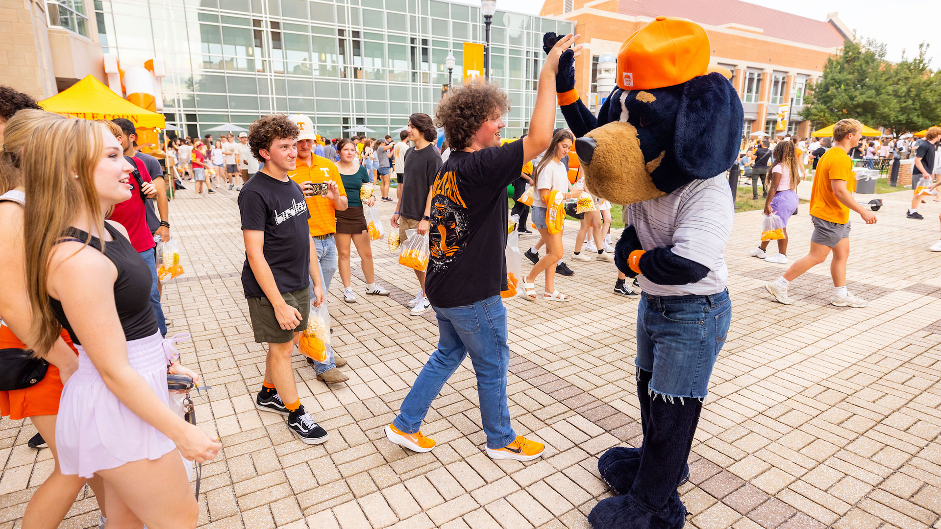 UT Knoxville mascot giving students high-fives.