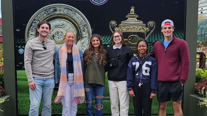 Six students standing together for a group photo.