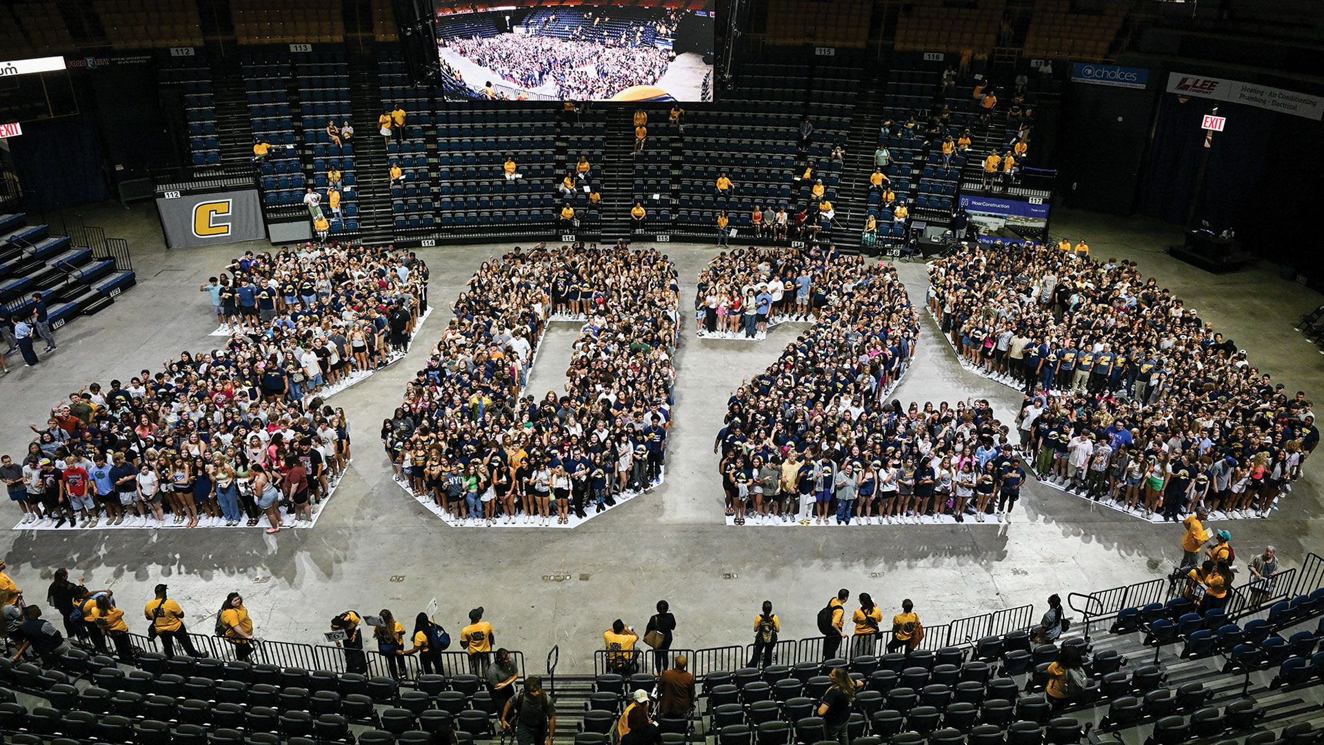 A new cohort of college freshmen standing in the shaping of their graduating year.
