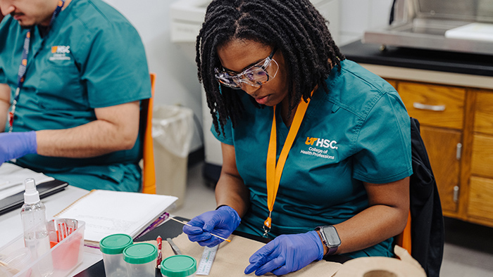 A medical student practicing lab skills.