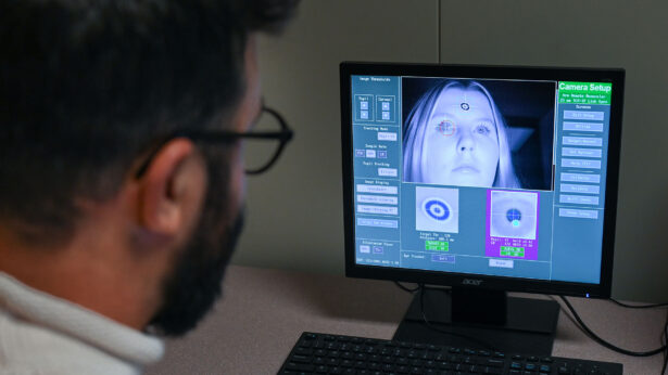 A man looking at a computer screen.