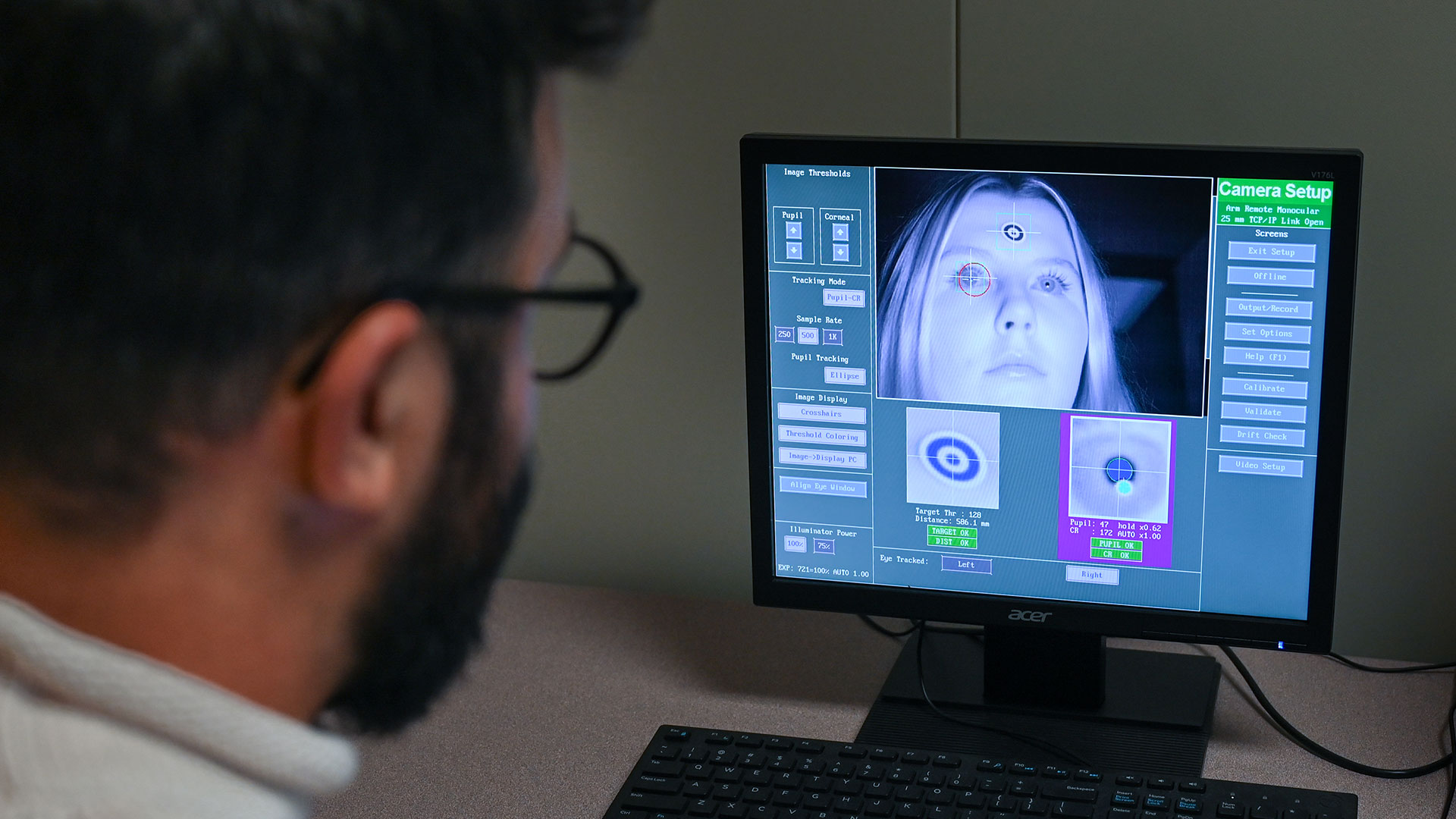 A man looking at a computer screen.