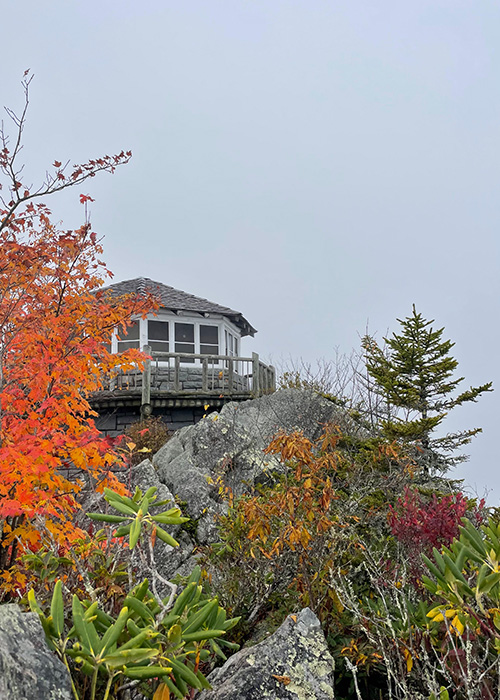 A lookout tower on top of a mountain.