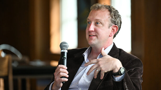 Man speaking with a microphone.