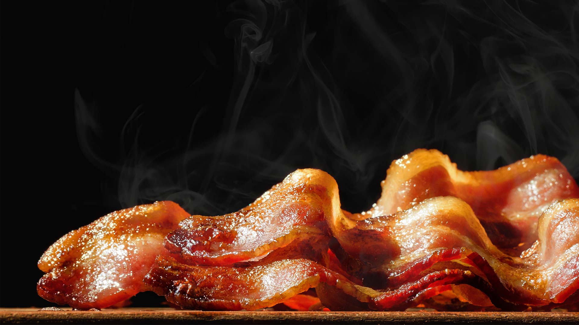 Close-up of steaming bacon.