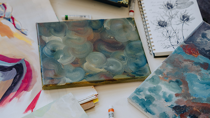 A collection of painted canvases.