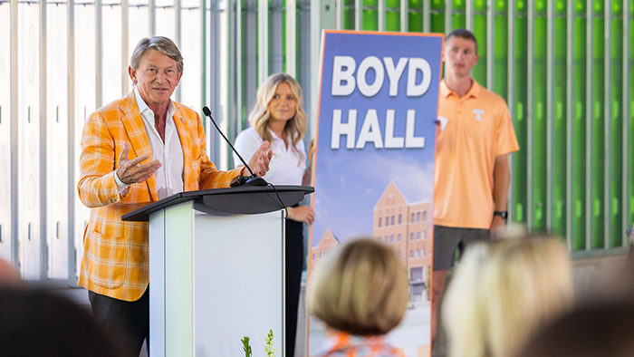A man speaking from behind a podium.