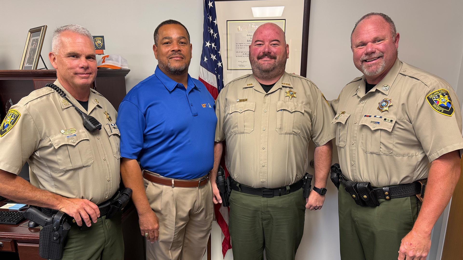 Four law enforcement officers posing for a photo.